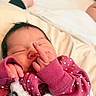 baby, bed, blanket, closeup, cozy, cute, face, fingers, hand, indoors, infant, middle_finger, newborn, peaceful, person, pink_clothing, polka_dot, skin, sleeping, soft