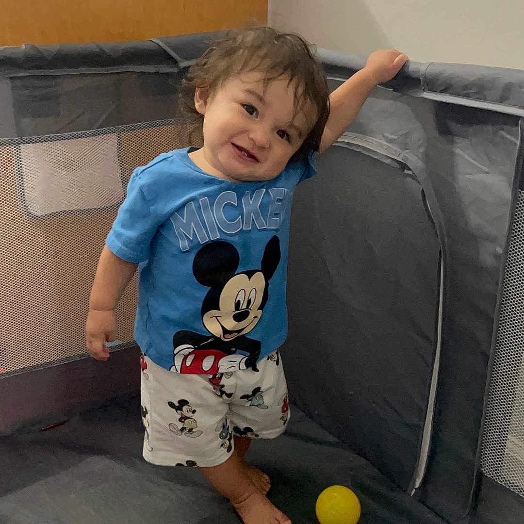 Percy is registered to the contest to win money with this photo: architecture, boy, building, child, clothing, couch, face, furniture, head, indoors, livingroom, male, pants, person, photography, portrait, room, shorts, sphere, t_shirt