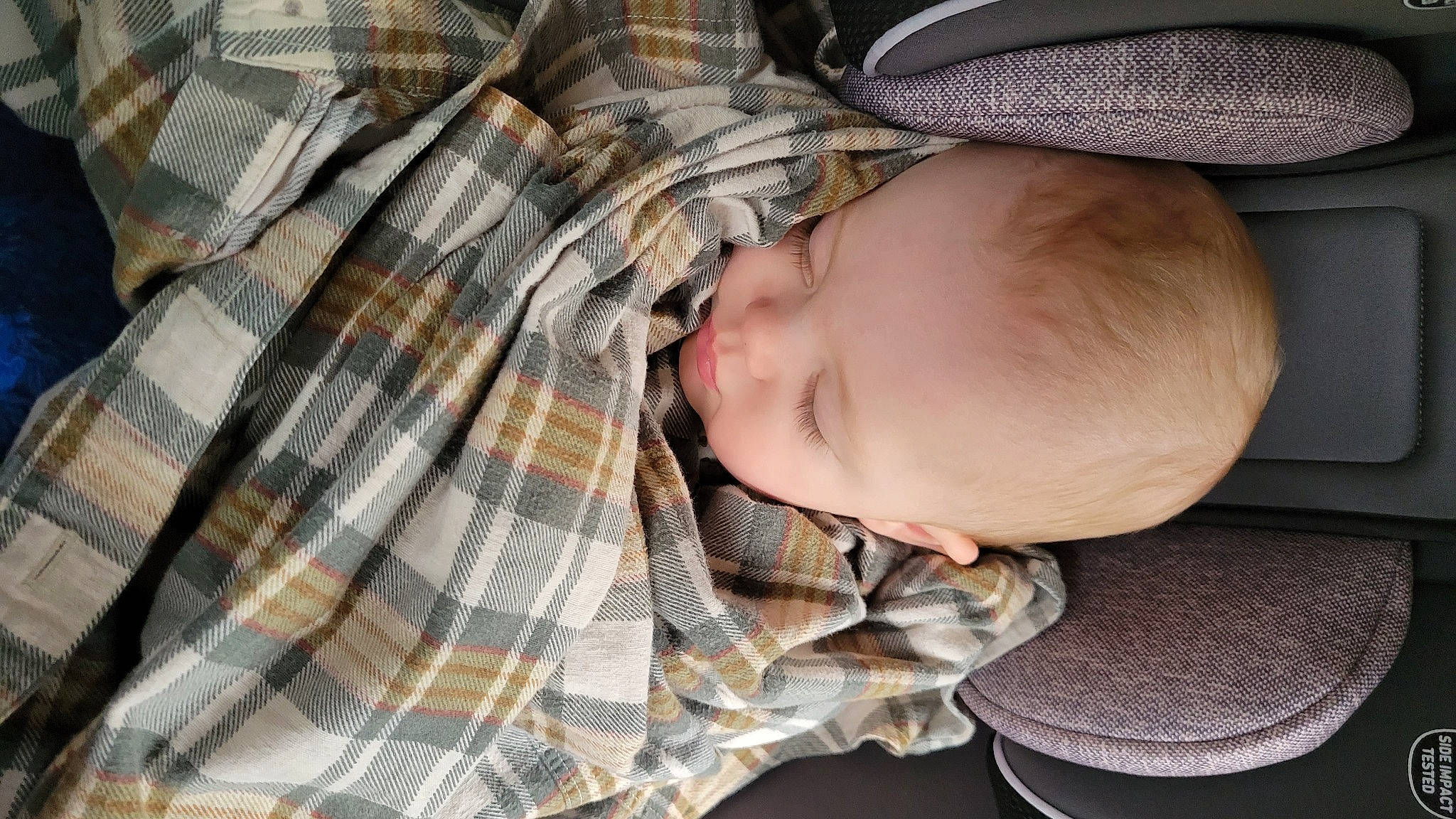 Jaxx joined the competition — help win amazing prizes! baby, baby_products, baby_safety, baby_toddler_clothing, cheek, child, comfort, facial_expression, linens, military_camouflage, nap, pattern, person, plaid, sitting, sleep, sleeve, tartan, textile, toddler