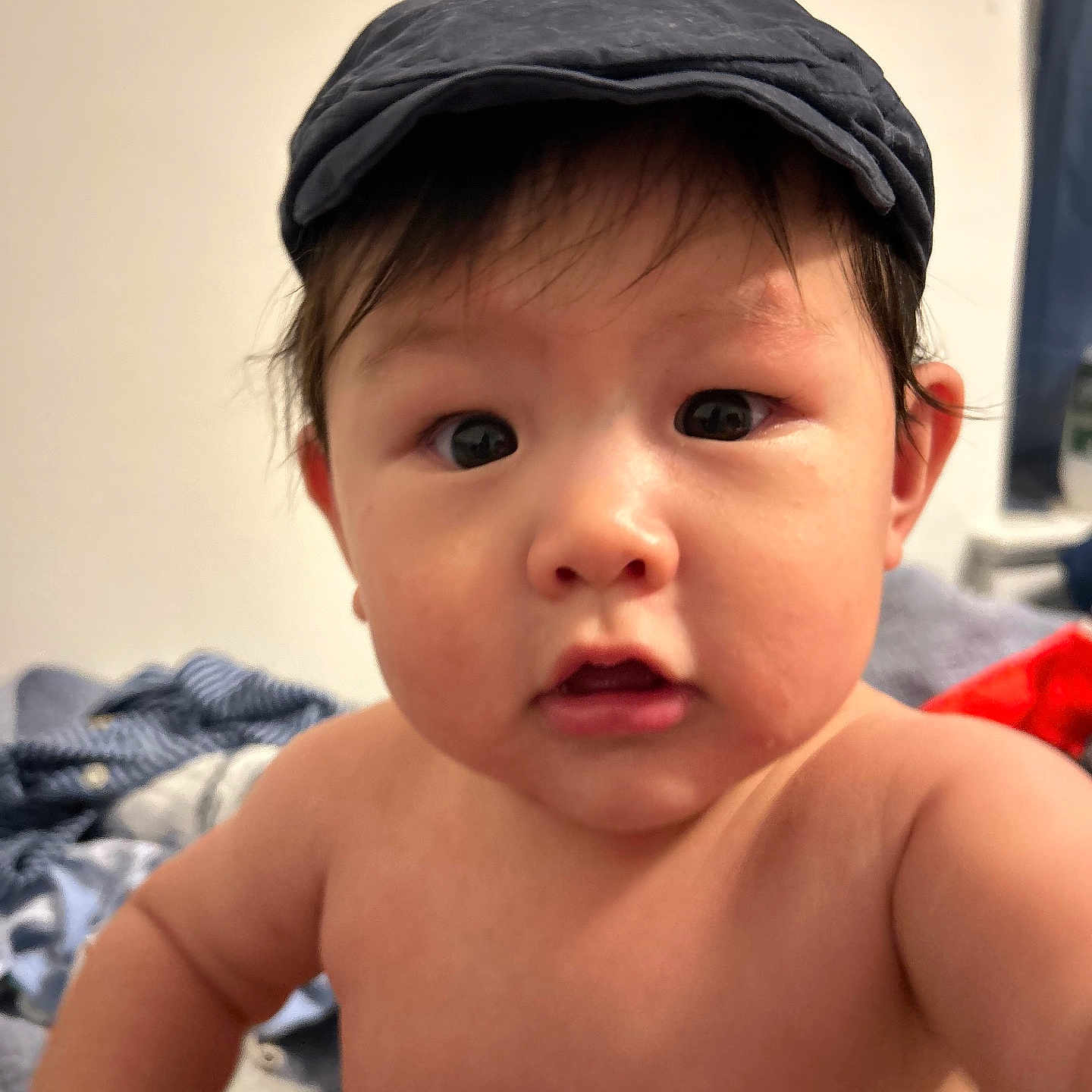 Jayden is registered to the contest to win money with this photo: baby, back, baseballcap, bodypart, bonnet, cap, clothing, face, finger, frown, hand, happy, hat, head, newborn, person, photography, portrait, sad, smile