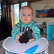 Ivan joined the competition — help win amazing prizes! baby, highchair, shoe, toy, blue, teal, hoodie, indoor, child, face, hand, table, painting, window, cup, can, wood, basket, sweatpants, expression
