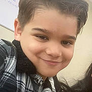 Aaron joined the competition — help win amazing prizes! child, boy, smile, indoor, portrait, face, hair, jacket, checkered, young, casual, happy, person, clothing, head, skin, expression, selfie, background, writing