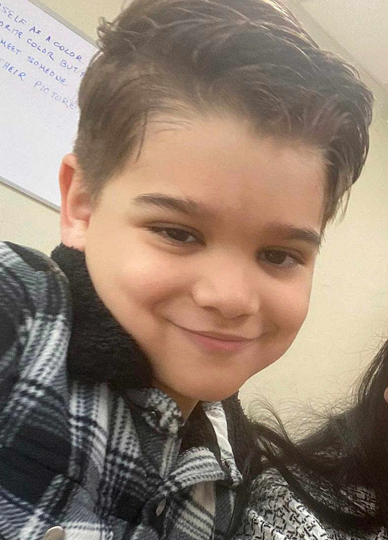 Aaron joined the competition — help win amazing prizes! child, boy, smile, indoor, portrait, face, hair, jacket, checkered, young, casual, happy, person, clothing, head, skin, expression, selfie, background, writing