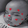 Esmeralda is registered to the contest to win money with this photo: newborn, baby, sleeping, portrait, face, close_up, black_and_white, heart_stickers, blanket, cozy, peaceful, indoors, infant, closed_eyes, resting, soft_lighting, textile, head, cheeks, cute
