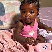 Jhersi joined the competition — help win amazing prizes! baby, infant, pink_clothing, blanket, pillow, bed, baby_lotion, skin_care, cute, indoor, child, portrait, curious, wide_eyes, sitting, soft_texture, home, adorable, young_child, comfortable
