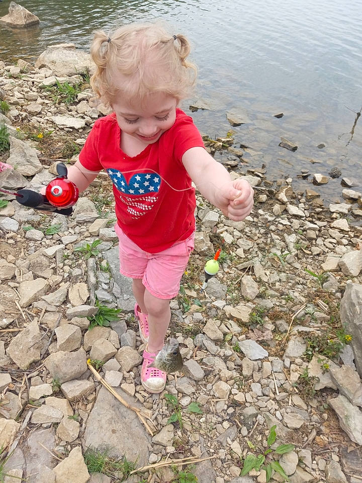 Morgan is registered to the contest to win money with this photo: baby_toddler_clothing, beach, child, fun, grass, lake, landscape, leisure, people_in_nature, person, play, puddle, recreation, rock, sand, shorts, soil, t_shirt, toddler, vacation