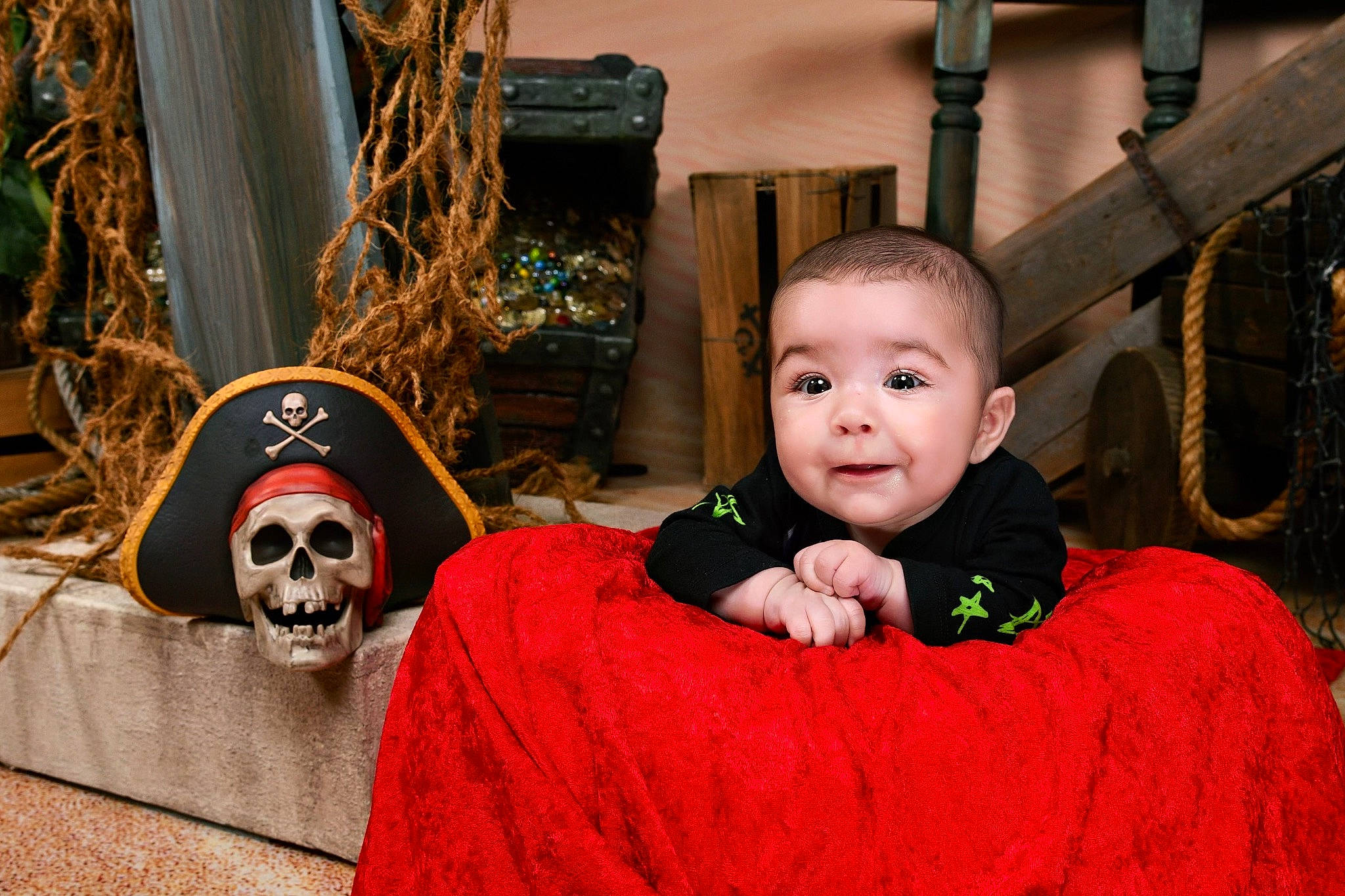 Mateo is registered to the contest to win money with this photo: bone, child, christmas, christmas_decoration, christmas_ornament, event, eye, fun, grass, happy, head, holiday, person, red, skull, smile, temple, toddler, tradition, tree