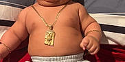 Krisniel is registered to the contest to win money with this photo: baby, bed, bracelet, child, chubby, comfort, cute, face, gold_chain, indoors, infant, jewelry, lying_down, pillow, red_blanket, shorts, skin, smiling, socks, striped_pillow