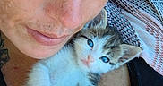 Little Baby joined the competition — help win amazing prizes! person, face, close_up, freckles, kitten, cat, pet, animal, blue_eyes, holding, cuddle, love, affection, indoor, casual, portrait, hand, skin, expression, cute