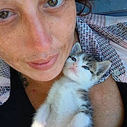 Little Baby joined the competition — help win amazing prizes! person, face, freckles, smile, kitten, cat, pet, cuddle, close_up, indoor, resting, relaxed, cute, fur, animal, young_cat, comfort, affection, human, portrait