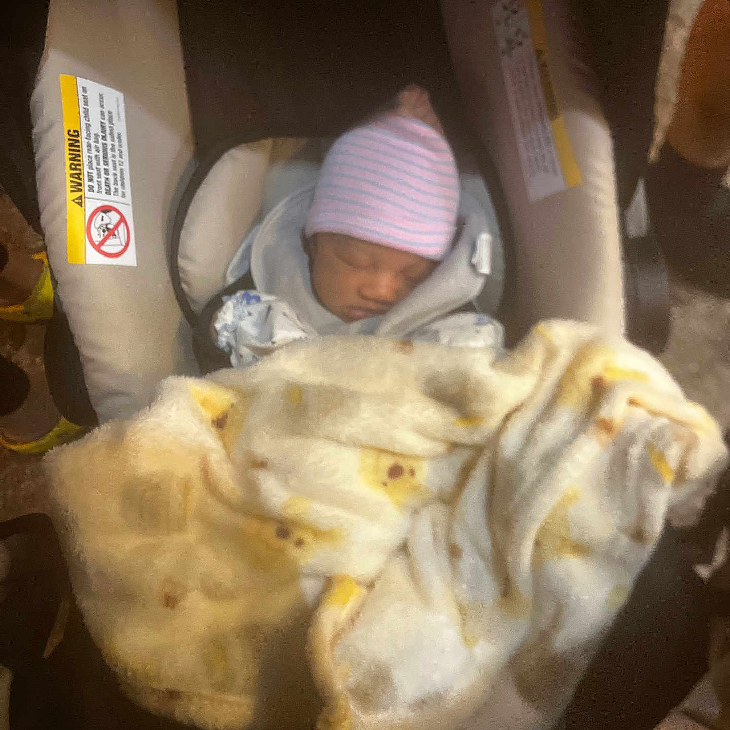Chozen joined the competition — help win amazing prizes! baby, car_seat, blanket, sleeping, hat, infant, child, fabric, warning_label, seat_belt, soft, indoor, clothing, comfort, cushion, person, headwear, baby_carrier, wrapped, resting
