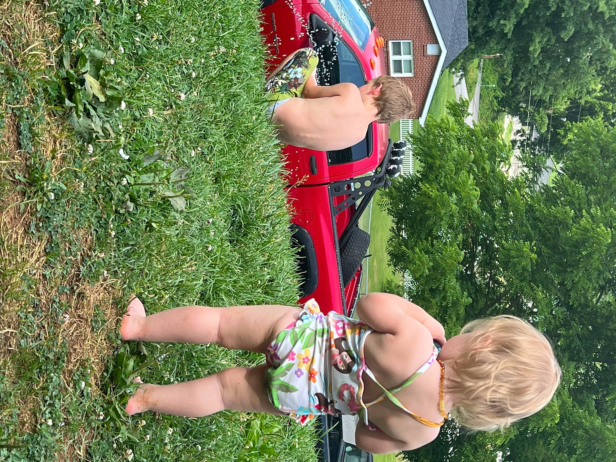 Eliyana is registered to the contest to win money with this photo: balance, elbow, fun, grass, human_leg, knee, leg, leisure, people_in_nature, person, plant, recreation, shorts, sock, sports_uniform, sportswear, thigh, toy, tree, trunk