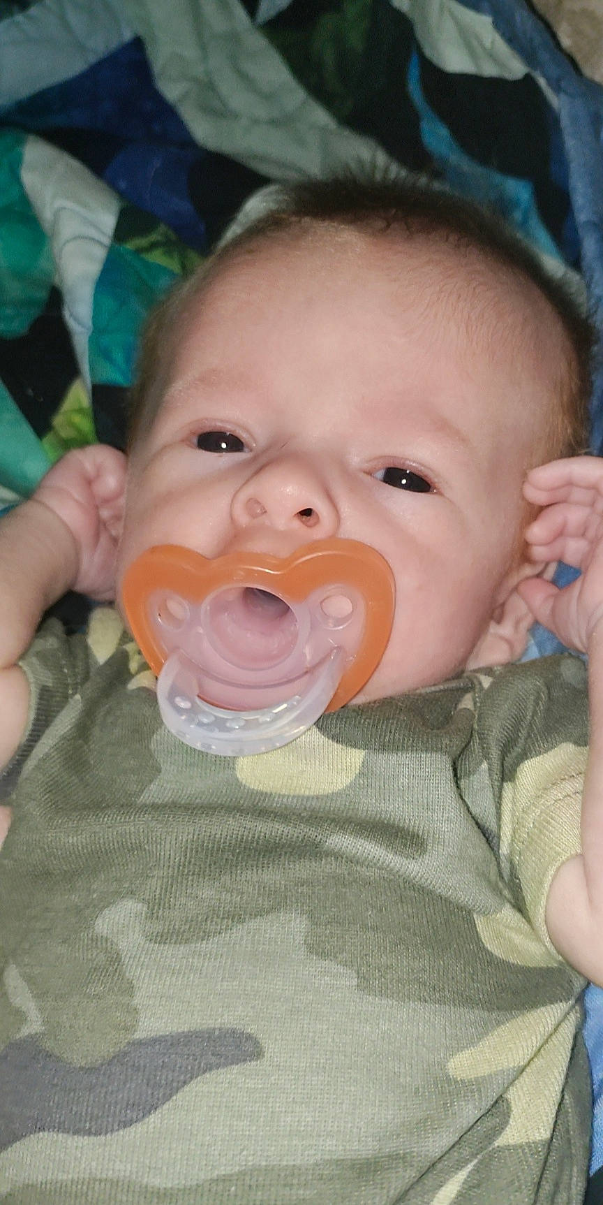 Terrence is registered to the contest to win money with this photo: baby, baby_toddler_clothing, cheek, child, chin, ear, eyebrow, eyelash, finger, forehead, fun, gesture, happy, iris, lip, mouth, nose, person, product, skin