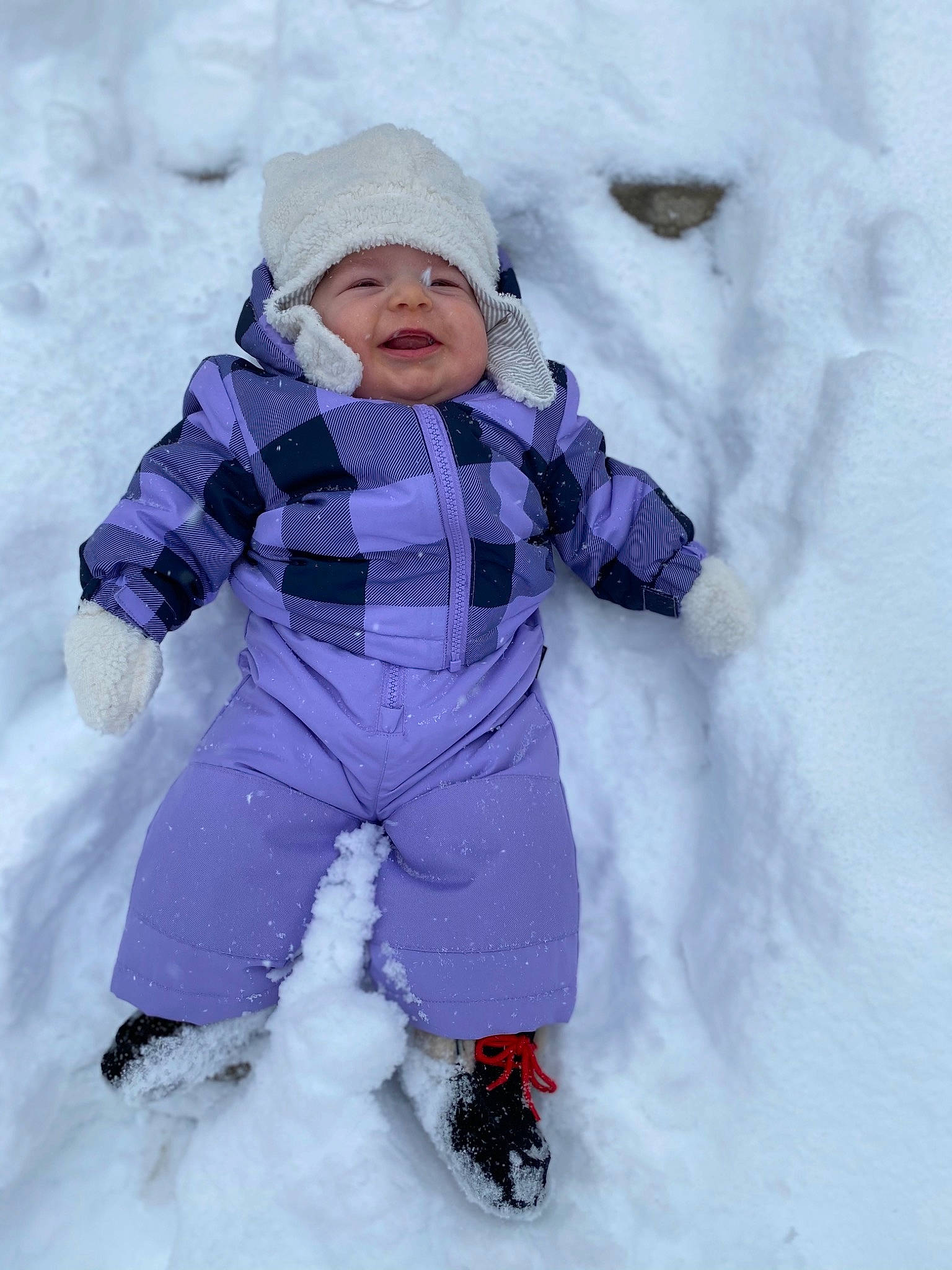 Natalie is registered to the contest to win money with this photo: arctic, baby_toddler_clothing, beanie, bonnet, cheek, child, cool, freezing, frost, geological_phenomenon, glacial_landform, glove, headwear, hood, ice_cap, knit_cap, person, playing_in_the_snow, precipitation, snow