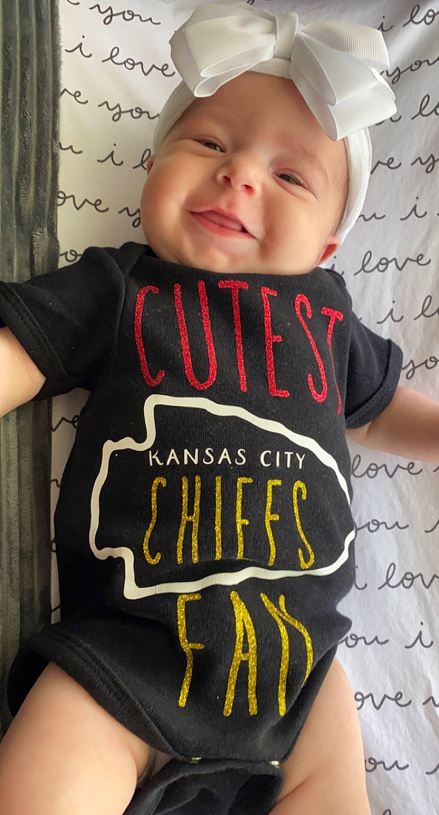 Natalie joined the competition — help win amazing prizes! arm, baby, baby_toddler_clothing, cap, child, clothing, cool, headgear, headwear, neck, person, product, sleeve, t_shirt, toddler