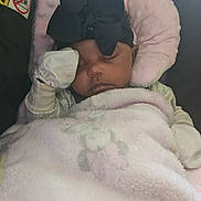 Dhoryian joined the competition — help win amazing prizes! baby, sleeping, blanket, bow, headband, cushion, pink, soft, child, infant, cute, resting, indoors, peaceful, closeup, face, person, toddler, cozy, plush