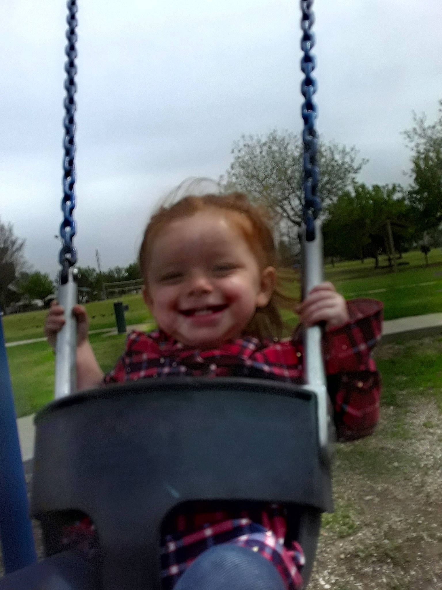 Nevaeha is registered to the contest to win money with this photo: child, fun, joy, outdoor_play_equipment, person, play, playground, public_space, recreation, smile, swing, toddler