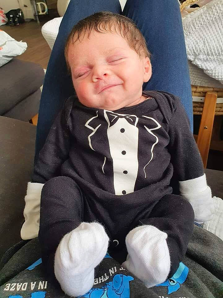 Dillon is registered to the contest to win money with this photo: baby, baby_carriage, baby_safety, baby_toddler_clothing, blue, cheek, comfort, cool, eye, face, facial_expression, hairstyle, happy, head, headgear, mouth, person, skin, sleeve, smile