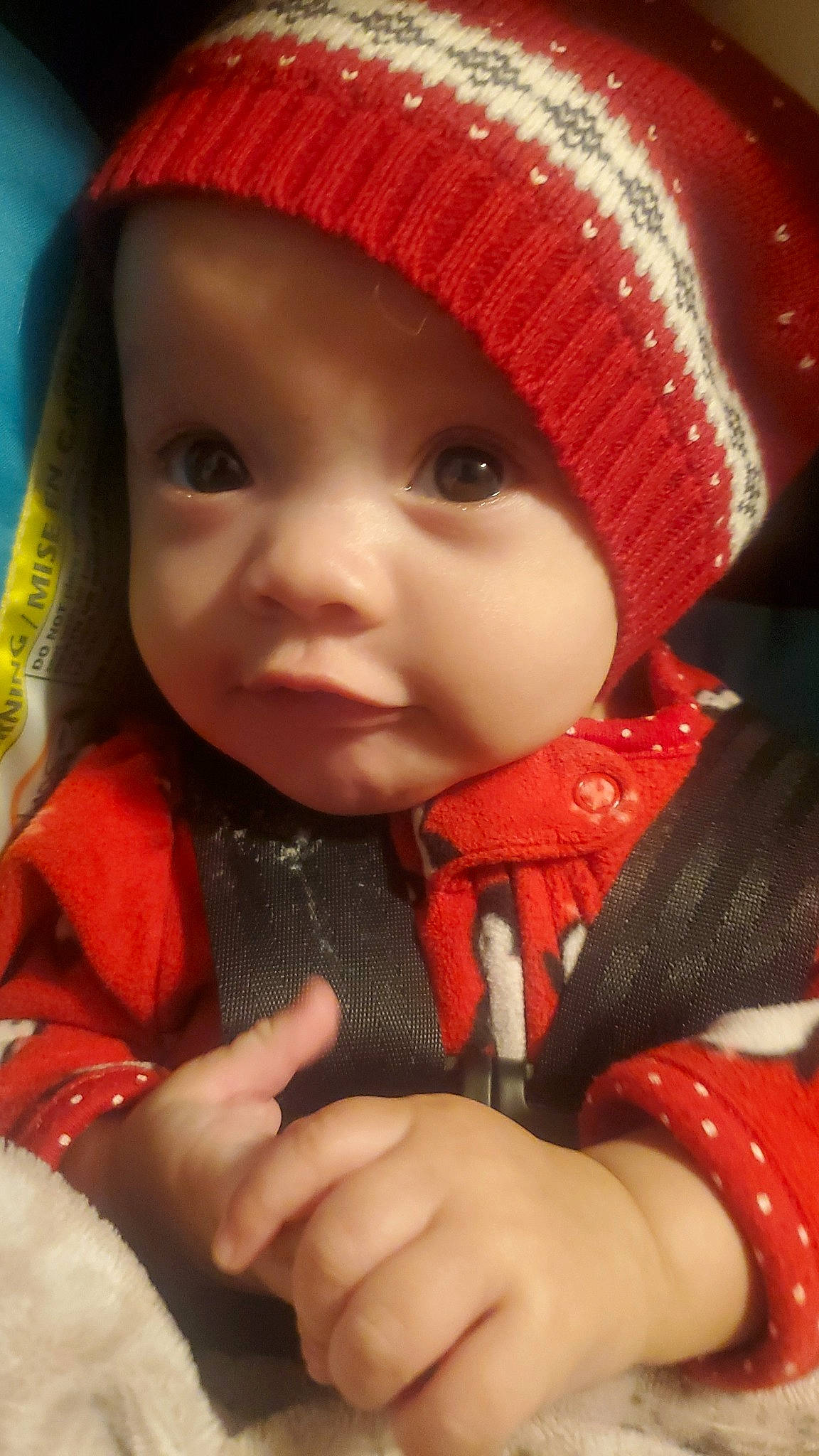Annika joined the competition — help win amazing prizes! baby, baby_toddler_clothing, cap, cheek, chin, clothing, cool, eye, face, head, headwear, human_body, lip, nose, outerwear, person, product, red, skin, sleeve