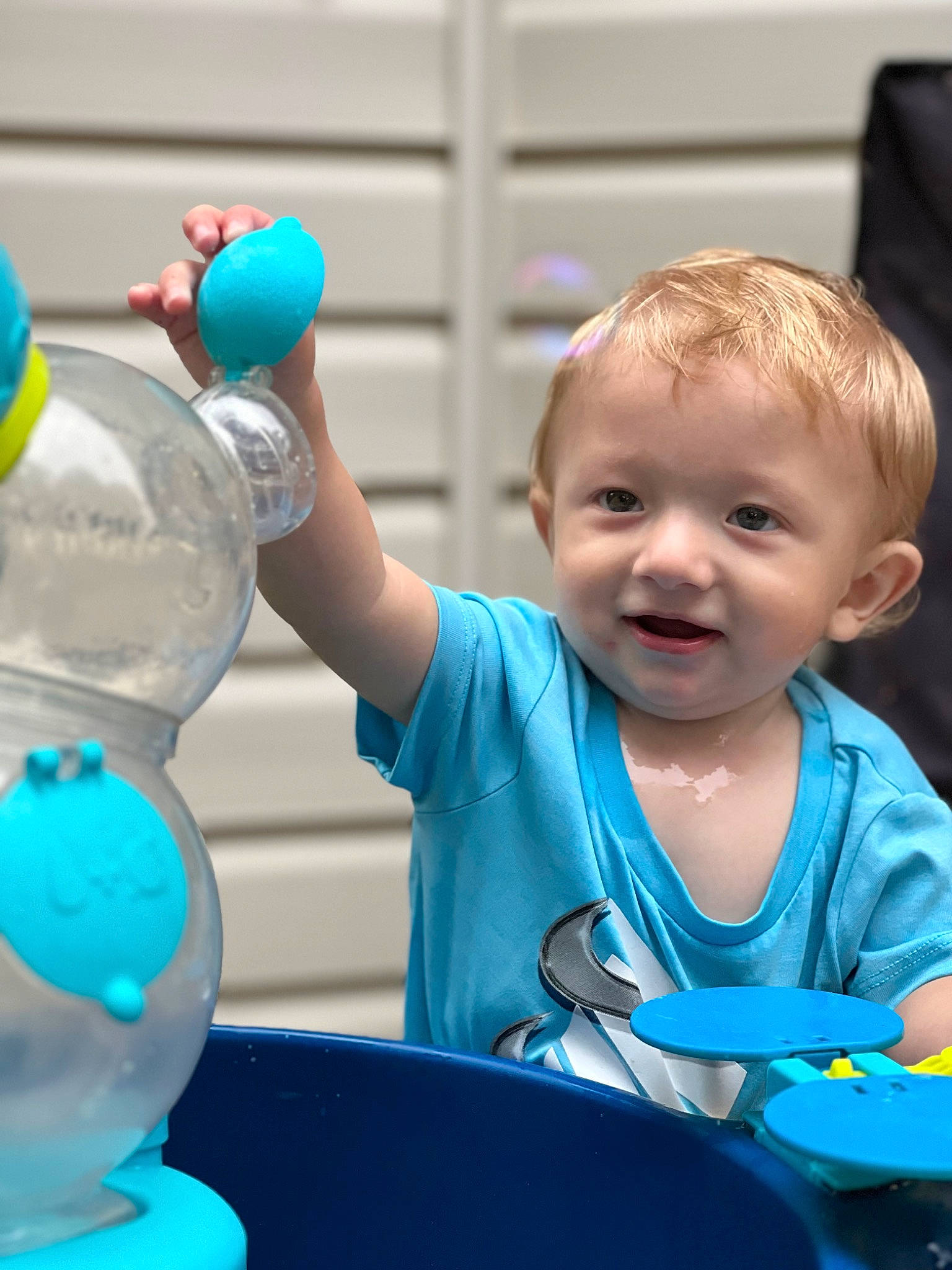 Robert is registered to the contest to win money with this photo: baby, baby_products, blue, child, electric_blue, event, fun, green, hand, happy, joy, leisure, party_supply, people, person, photograph, plastic_bottle, recreation, smile, snapshot