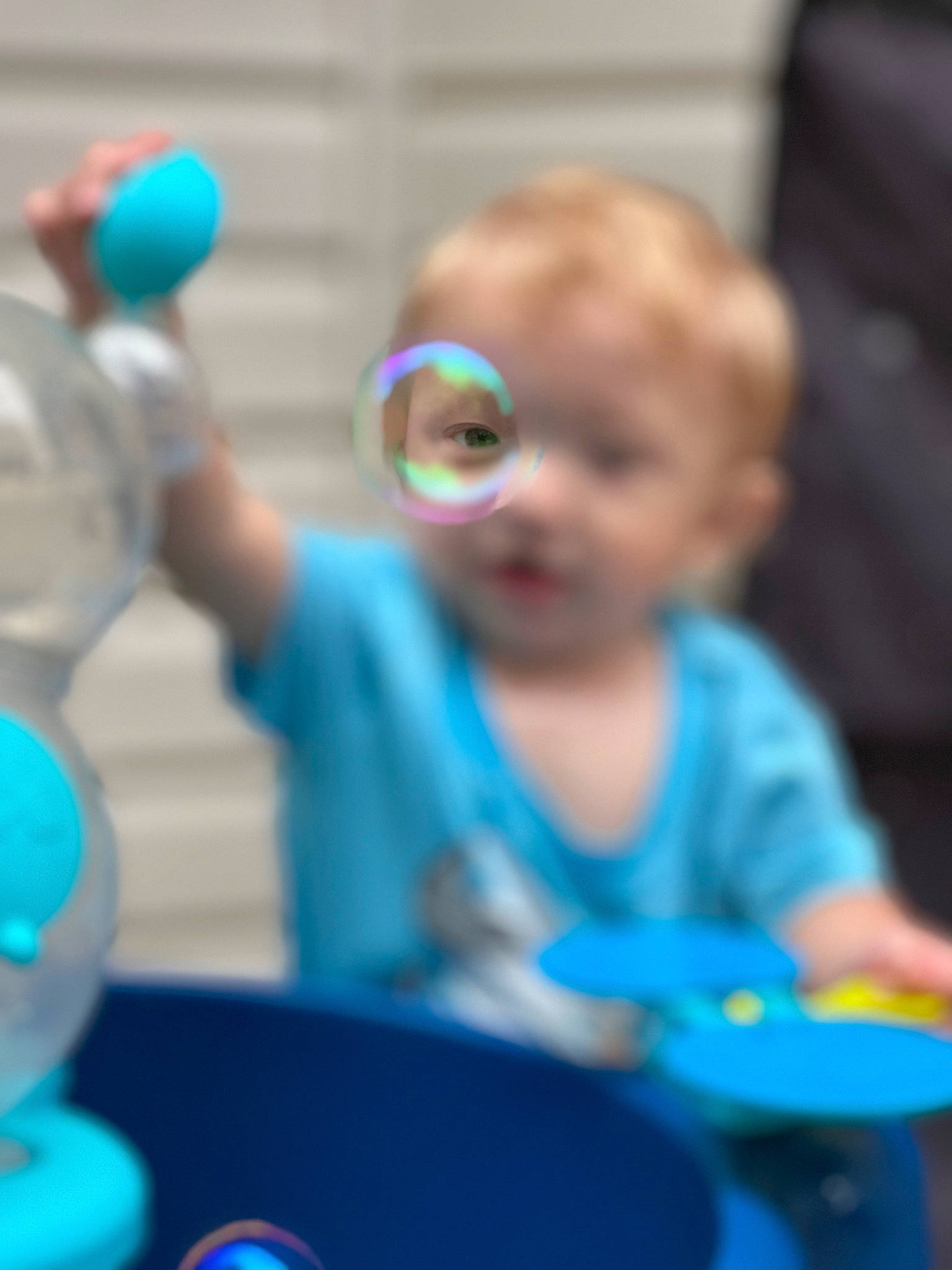Robert is registered to the contest to win money with this photo: baby, baby_products, baby_toddler_clothing, baby_toys, blue, child, electric_blue, event, fun, happy, head, leisure, person, plastic, play, product, recreation, room, sitting, toddler