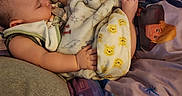 Sylas is registered to the contest to win money with this photo: baby, blanket, sleeping, foot, sock, winnie_the_pooh, bed, bedding, child, cozy, cute, indoor, person, soft_texture, resting, colorful, cartoon, sleep, infant, clothing