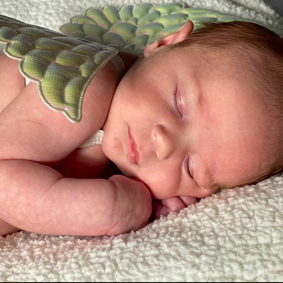 Millie joined the competition — help win amazing prizes! baby, baby_sleeping, baby_toddler_clothing, bedding, bedtime, cheek, child, comfort, eye, grass, headgear, iris, linens, mouth, nap, nose, plant, skin, thumb, toddler