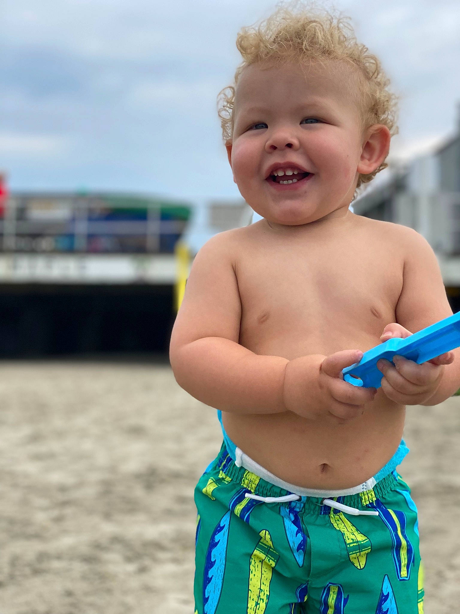 Cash is registered to the contest to win money with this photo: abdomen, barechested, beach, chest, cloud, fun, happy, head, human_body, joy, leisure, people_in_nature, people_on_beach, person, sky, smile, summer, swimwear, toddler, trunk