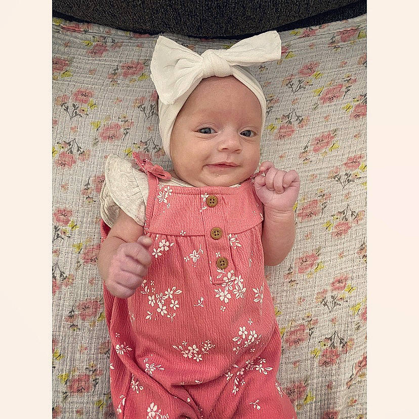 Baylee joined the competition — help win amazing prizes! baby, baby_toddler_clothing, beauty, clothing, collar, dress, face, fashion_accessory, happy, head, headwear, magenta, outerwear, pattern, person, pink, product, skin, sleeve, smile