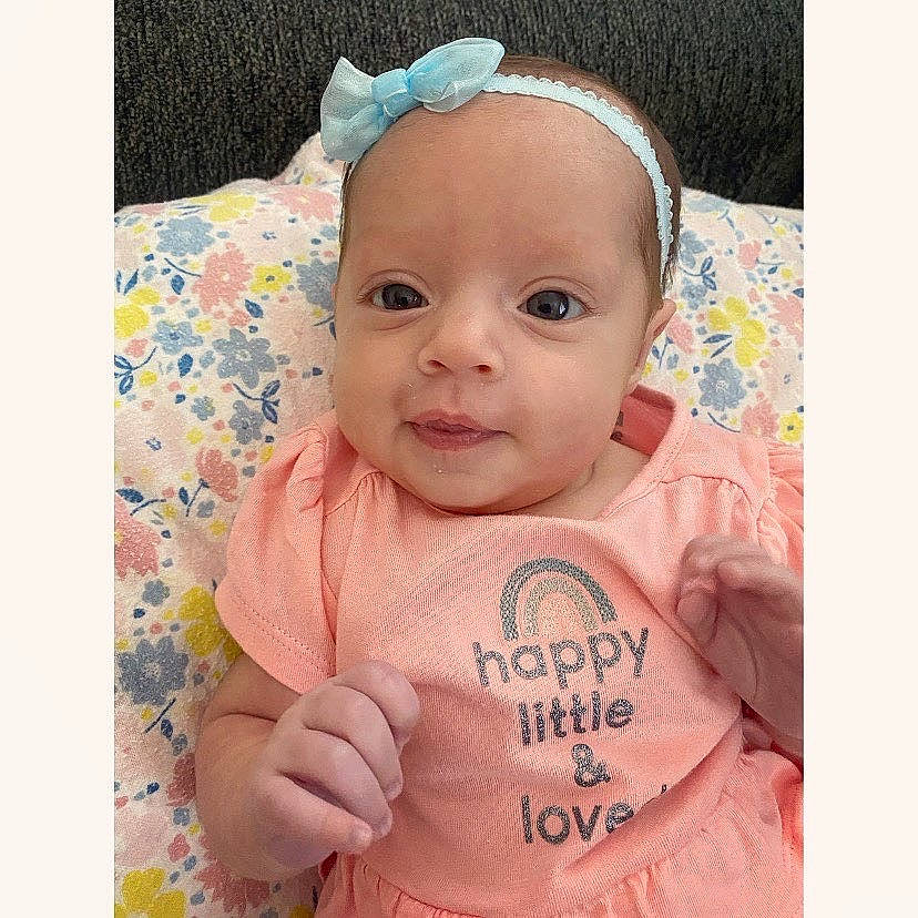 Baylee joined the competition — help win amazing prizes! baby_toddler_clothing, cheek, clothing, ear, eye, eyebrow, eyelash, face, facial_expression, head, human_body, iris, lip, neck, nose, person, product, skin, sleeve, smile