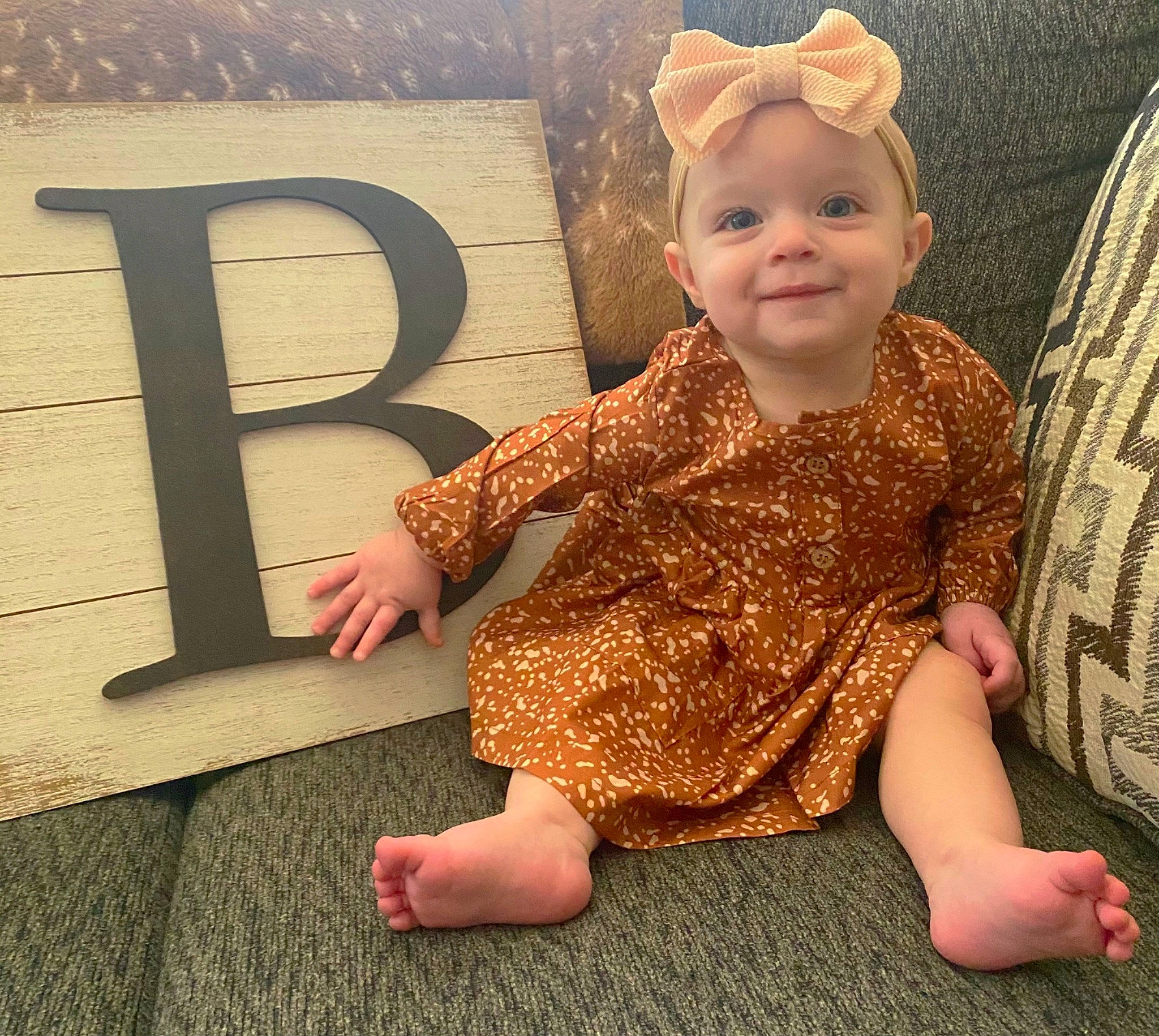 Brynlee is registered to the contest to win money with this photo: baby, baby_toddler_clothing, beauty, cap, cool, dress, finger, flooring, fun, gesture, happy, headgear, headwear, joy, person, pink, skin, sleeve, smile, t_shirt