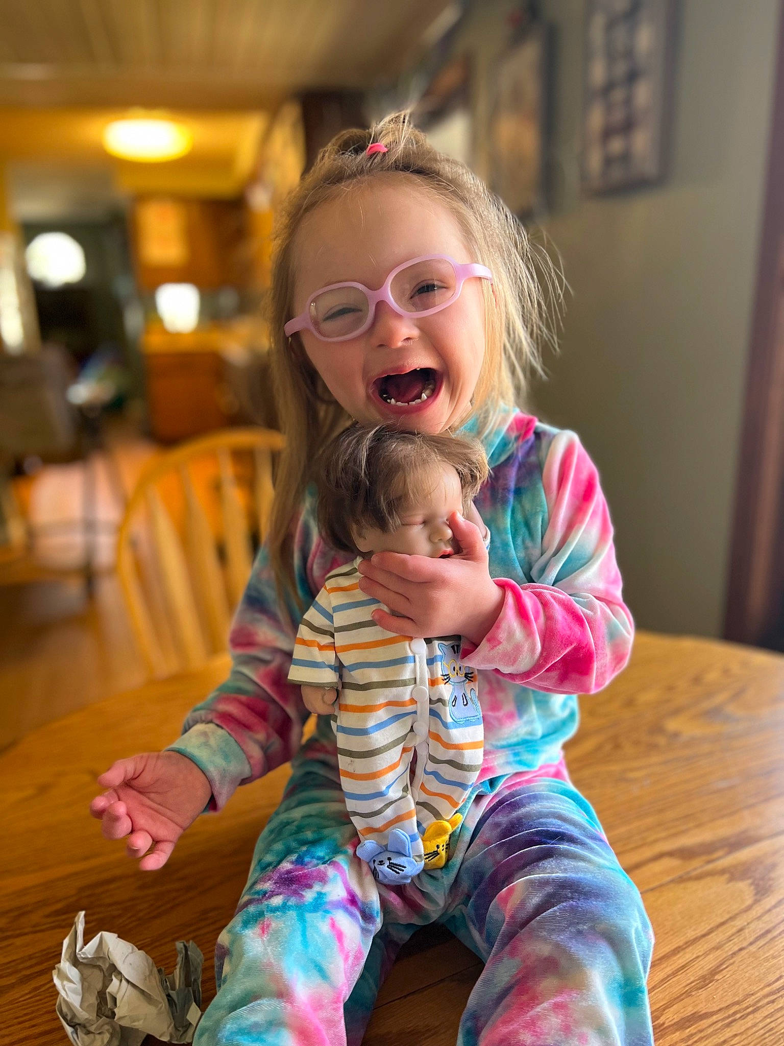 Kaci joined the competition — help win amazing prizes! baby_toddler_clothing, blond, child, flooring, fun, gesture, hair, happy, head, leisure, mammal, person, picture_frame, shoulder, skin, smile, standing, thigh, thumb, toddler