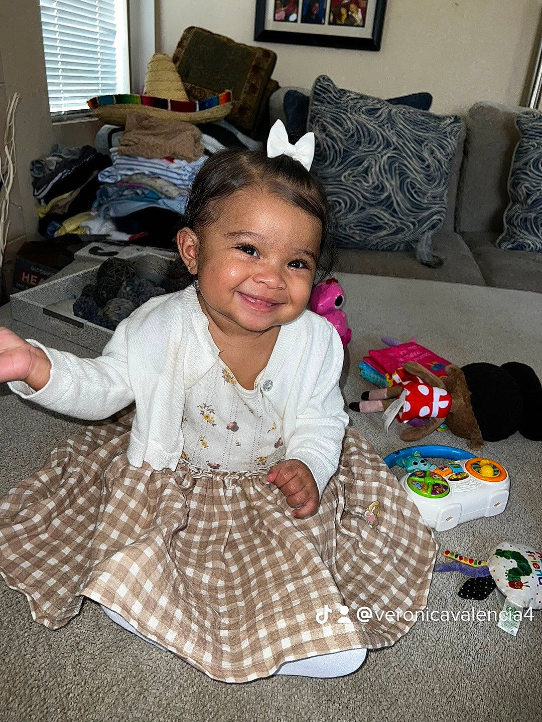 Kailani is registered to the contest to win money with this photo: baby_toddler_clothing, child, comfort, computer, computer_keyboard, computer_monitor, couch, desk, flooring, fun, happy, joy, living_room, mammal, people, peripheral, person, personal_computer, picture_frame, sitting