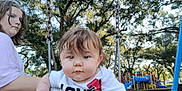 Caspain joined the competition — help win amazing prizes! baby, child, swing, playground, trees, outdoor, park, person, young_girl, grass, daylight, clothing, play_equipment, fun, nature, summer, smile, cute, face, recreation
