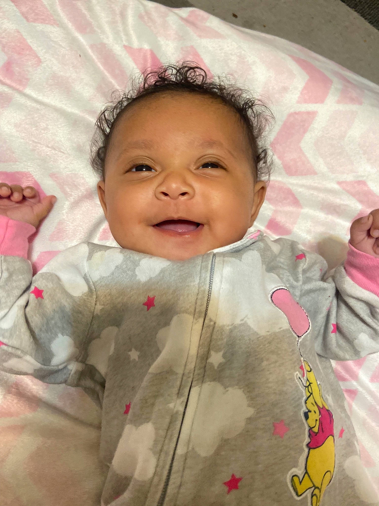 Kaleah is registered to the contest to win money with this photo: baby, baby_toddler_clothing, cheek, chin, eyebrow, facial_expression, forehead, gesture, happy, human, lip, military_camouflage, mouth, nose, person, pink, skin, sleeve, smile, textile