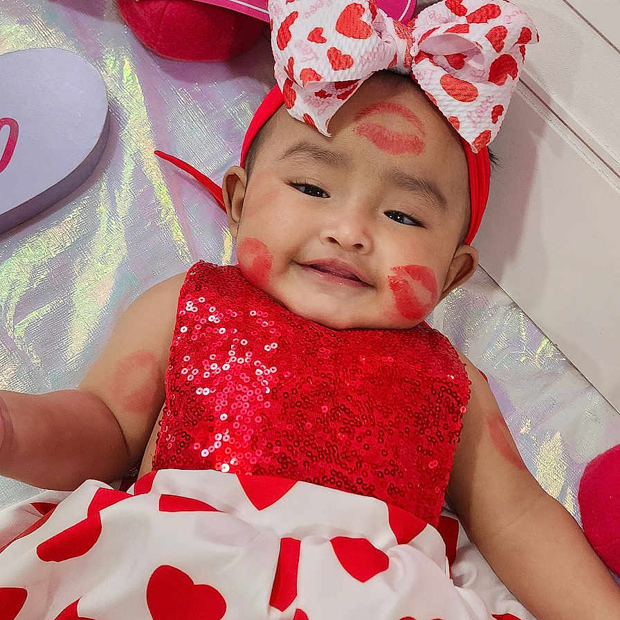 Arelyn joined the competition — help win amazing prizes! baby, bodypart, bonnet, cap, clothing, costume, cushion, dress, face, finger, hand, happy, hat, head, homedecor, newborn, person, photography, portrait, smile