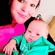 Imari-Lynn joined the competition — help win amazing prizes! woman, baby, child, portrait, indoor, clothing, pink, green, face, person, holding, cute, hair_tie, smile, casual, parent, childcare, family, skin, expression