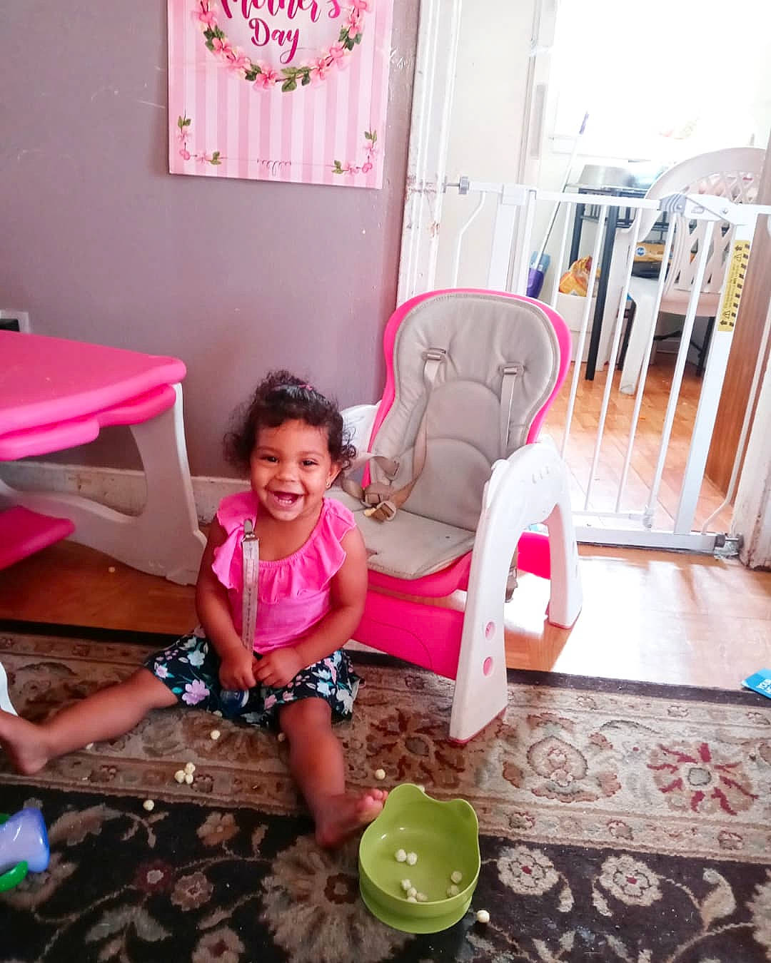 Amora is registered to the contest to win money with this photo: chair, child, comfort, floor, flooring, furniture, happy, interior_design, joy, leg, leisure, magenta, person, pink, purple, shoe, shorts, smile, sneakers, textile
