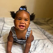 Nazariyah joined the competition — help win amazing prizes! baby, child, smiling, crawling, pigtails, blue_bow, floor, tile_floor, indoor, cute, happy, person, portrait, infant, young_child, skin, clothing, baby_girl, closeup, head