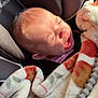 Madeline is registered to the contest to win money with this photo: baby, infant, newborn, car_seat, blanket, pacifier, crying, face, head, harness, seat, hand, sunlight, closeup, soft_texture, portrait, safety, upclose, fabric, sleepwear