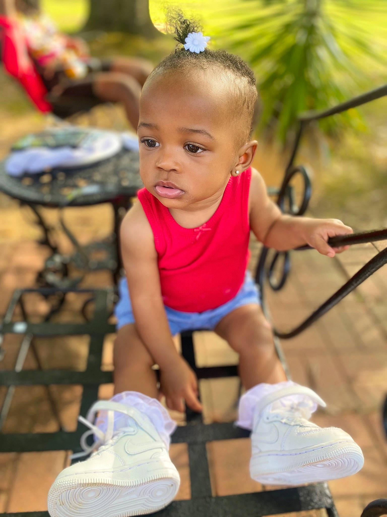 Taryah joined the competition — help win amazing prizes! beauty, chair, child, event, fun, grass, green, happy, human_leg, leisure, mammal, person, recreation, shorts, sitting, skin, sneakers, sock, thigh, toddler