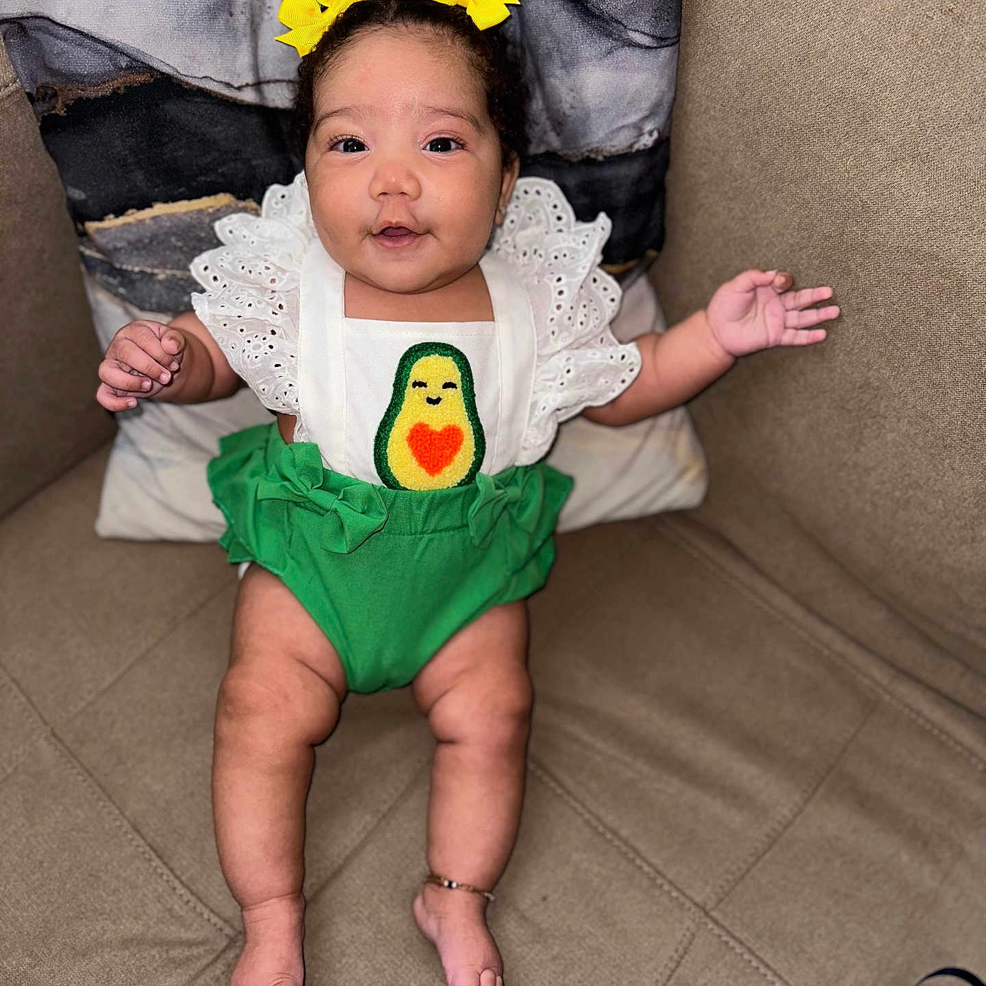 Alana is registered to the contest to win money with this photo: architecture, baby, bodypart, clothing, costume, couch, cushion, face, finger, furniture, hand, head, homedecor, person, photography, pillow, portrait, shorts, sitting, t_shirt