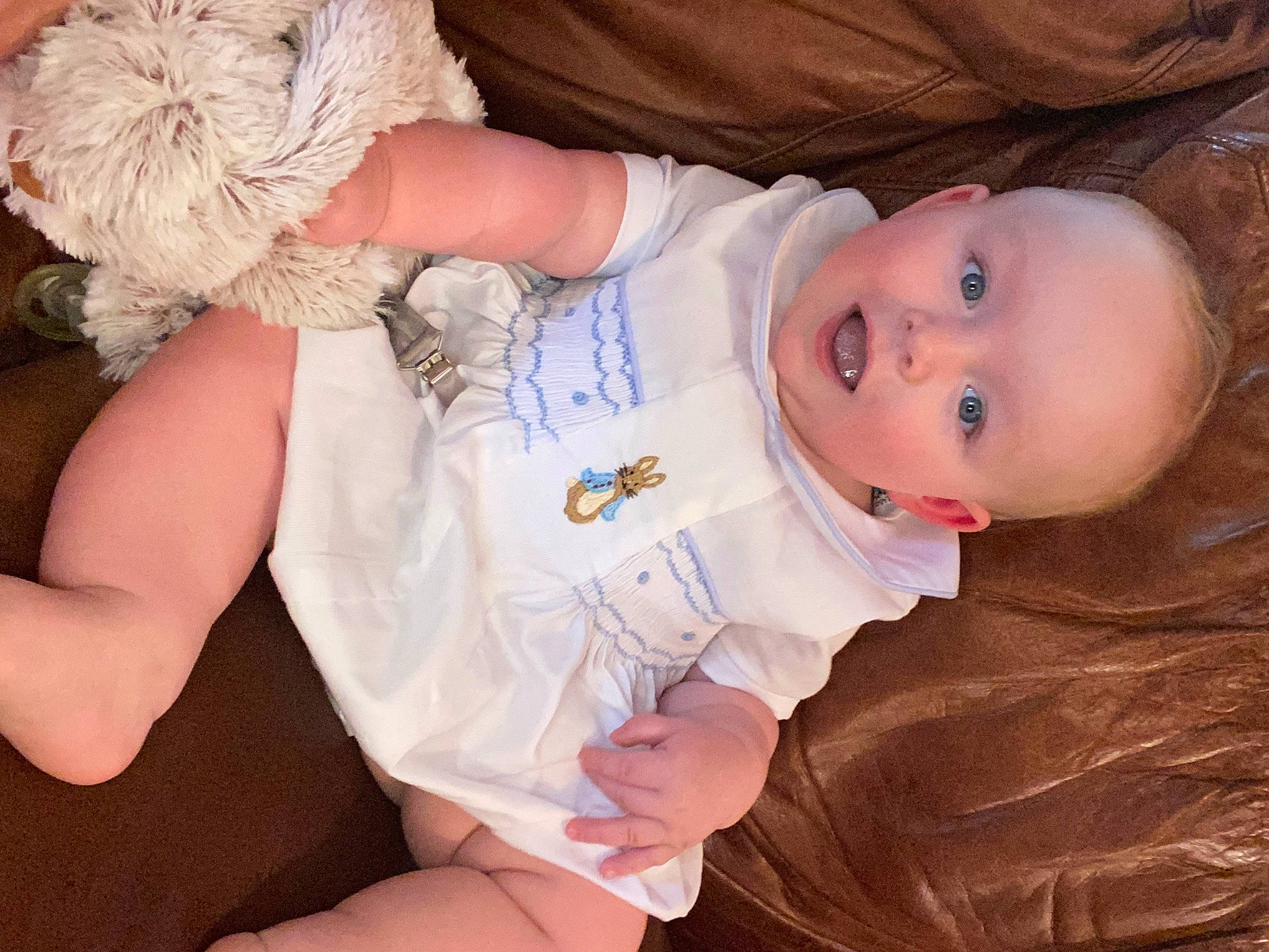 Win is registered to the contest to win money with this photo: baby, baby_toddler_clothing, cheek, child, comfort, finger, gesture, hand, happy, iris, leg, nose, person, sitting, skin, sleeve, smile, surprise, textile, thigh