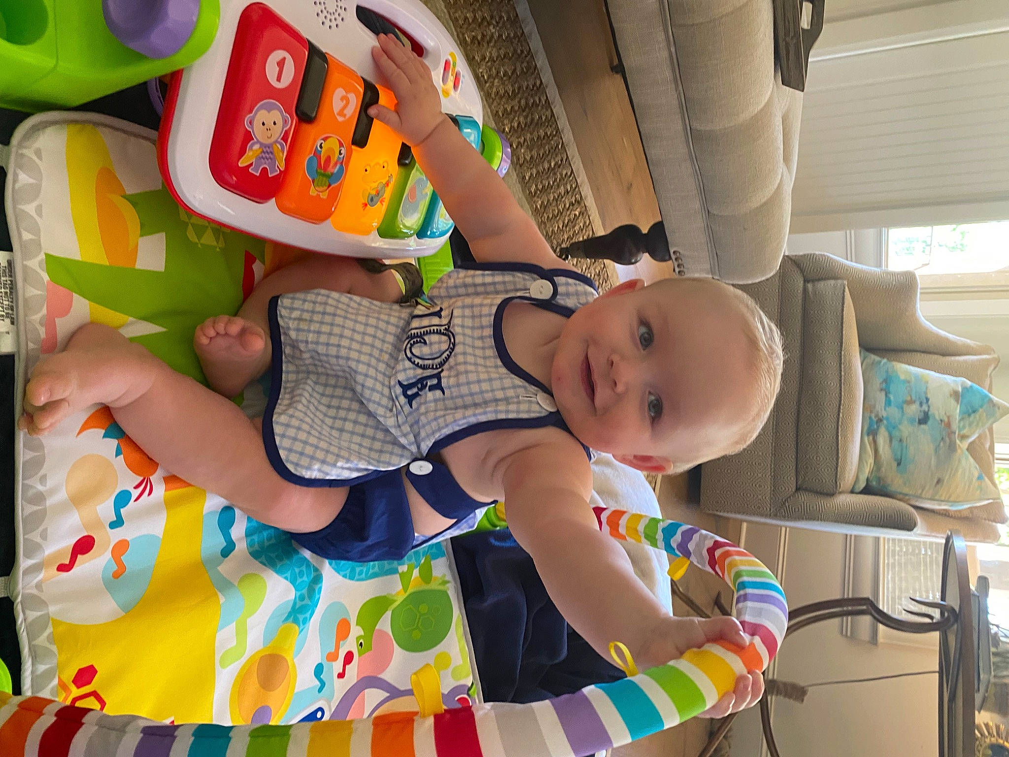 Win is registered to the contest to win money with this photo: baby, baby_products, baby_toddler_clothing, child, comfort, fun, happy, joy, leisure, pattern, person, play, room, sitting, smile, t_shirt, textile, thigh, toddler, toy