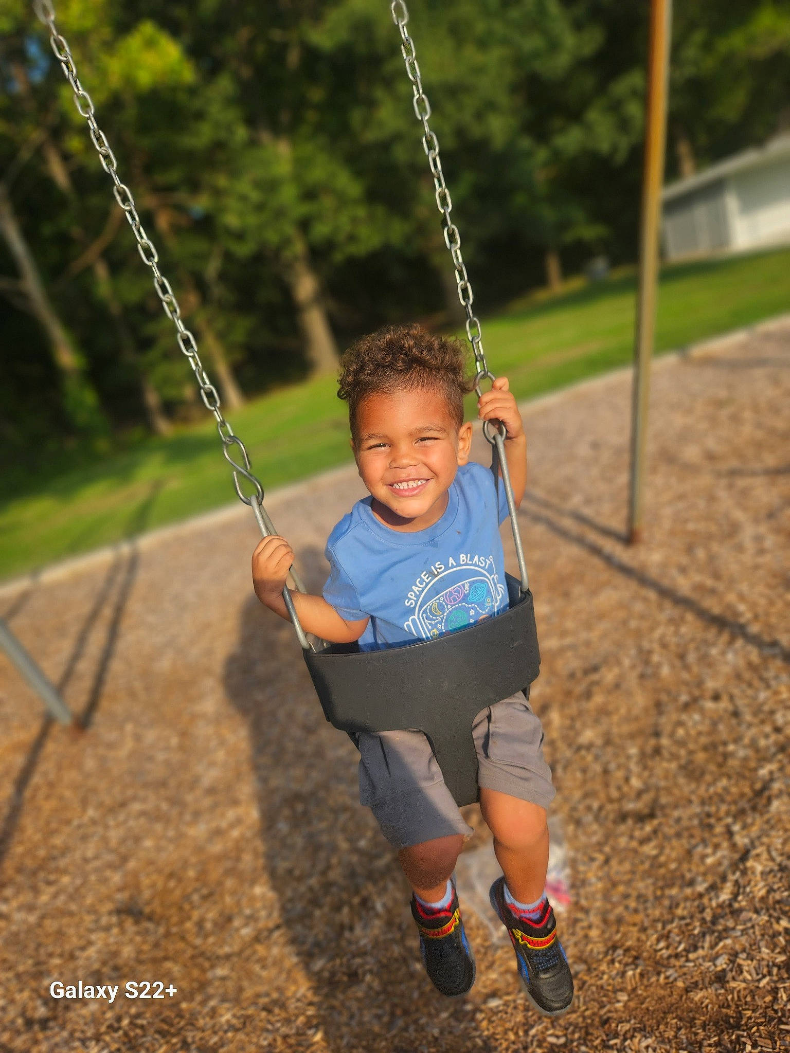 Kasen is registered to the contest to win money with this photo: baby, beauty, electric_blue, fun, grass, hand, happy, human_body, joy, leisure, people_in_nature, person, plant, playground, recreation, shorts, smile, summer, swing, toddler
