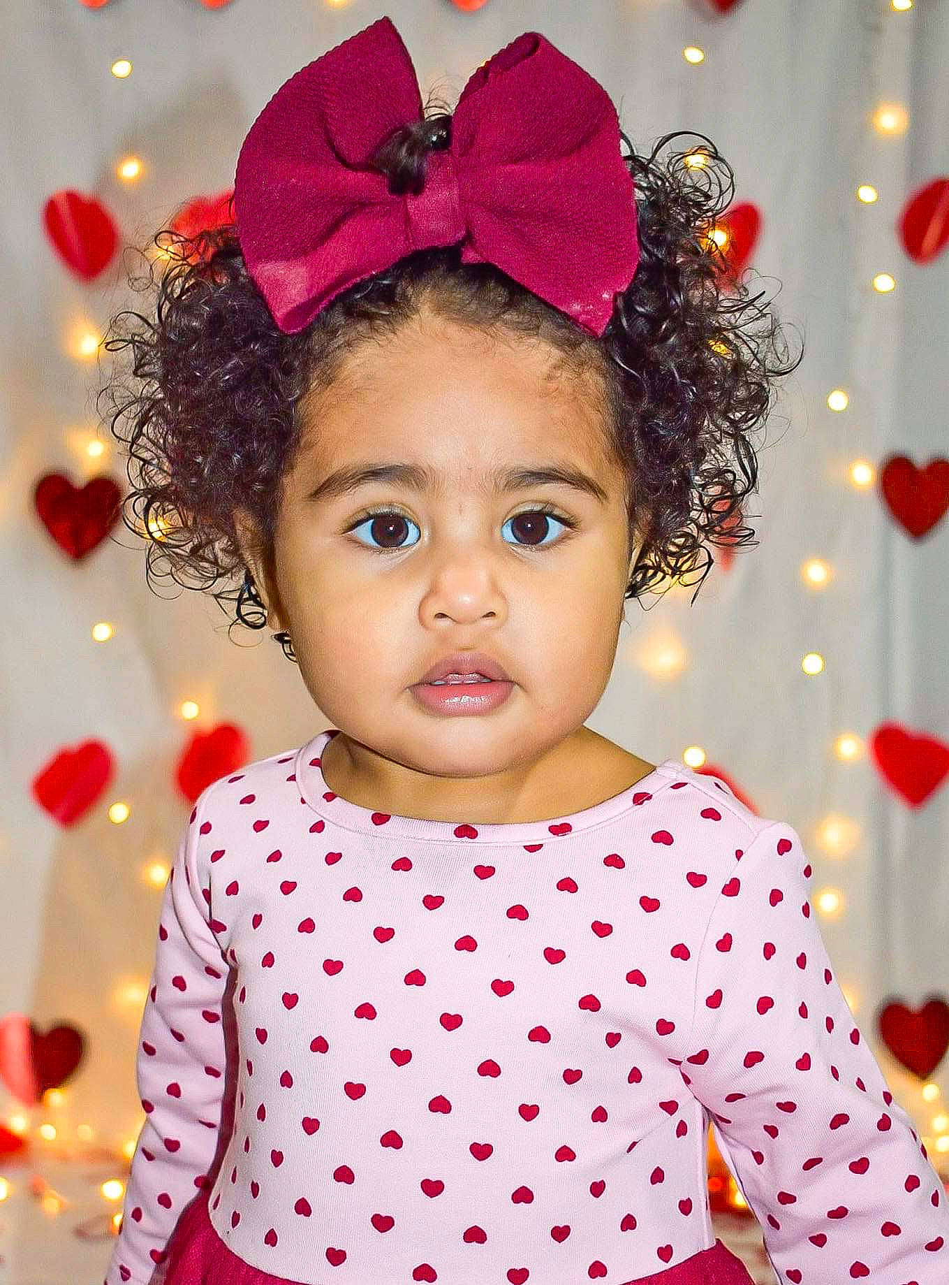 Adrienne is registered to the contest to win money with this photo: baby, child, christmas_eve, fashion_accessory, hair_accessory, happy, head, headgear, headpiece, magenta, party, party_hat, pattern, person, photography, pink, polka_dot, smile, toddler