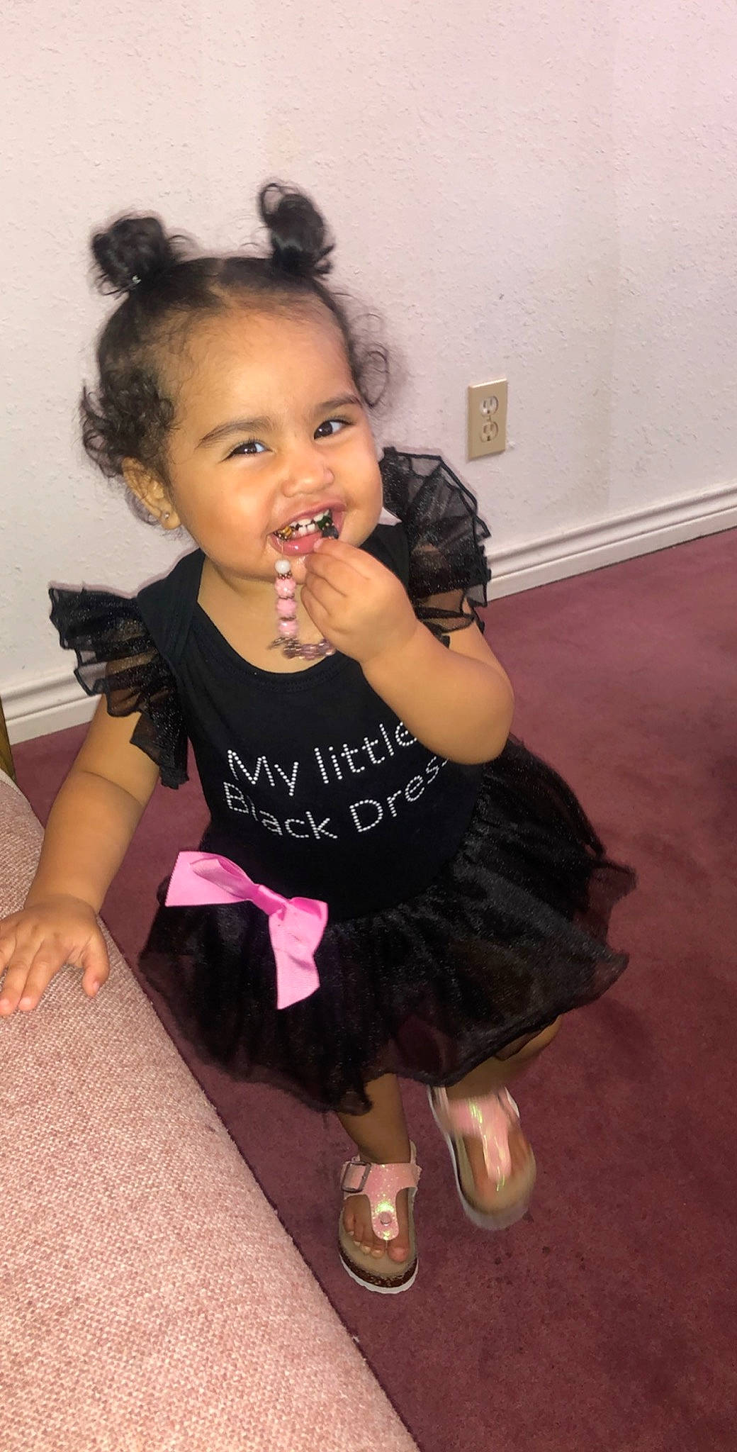Adrienne joined the competition — help win amazing prizes! black_hair, cheek, child, costume, dress, finger, hair, hairstyle, joy, person, pink, shoulder, sitting, skin, toddler