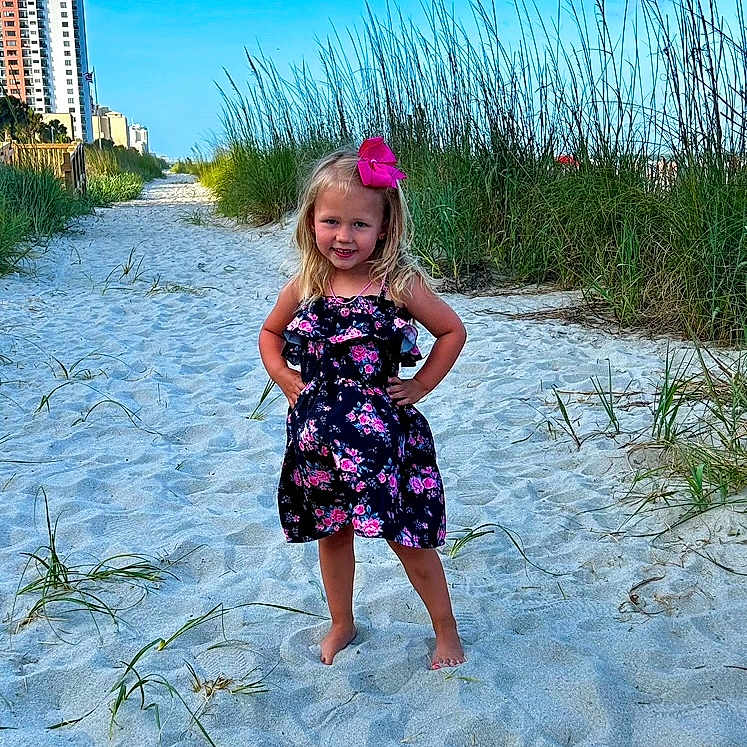Sadie joined the competition — help win amazing prizes! beach, beachwear, child, city, clothing, coast, dress, face, female, girl, grass, head, nature, outdoors, person, photography, plant, portrait, sea, soil