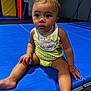 Kenzleigh is registered to the contest to win money with this photo: baby, barefoot, blue_mat, candid, child, curious, cute, expression, floor, gym_mat, indoor, person, play_area, polka_dot, portrait, sitting, toddler, yellow_bow, yellow_outfit, young_child