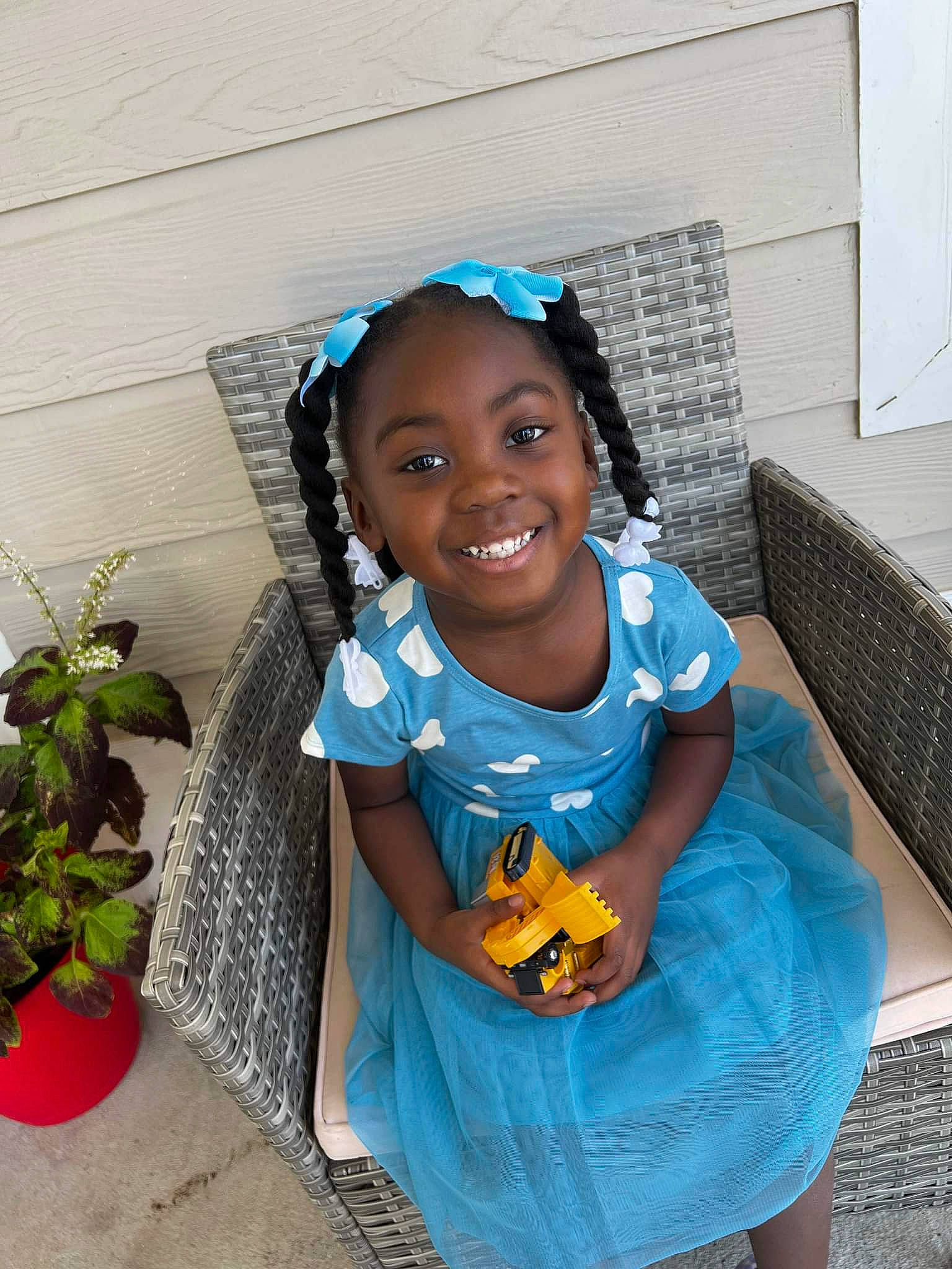 Kinsley joined the competition — help win amazing prizes! aqua, azure, baby_toddler_clothing, chair, child, electric_blue, flooring, flowerpot, fun, hair, happy, houseplant, joy, person, plant, pumpkin, room, sandal, sitting, smile